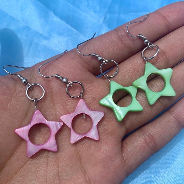 These stars come in a soft punk and a light green. Earring metal is hypoallergenic surgical steel. Green Star-shaped Handmade Jewelry, Handmade Green Star-shaped Jewelry, Green Star Earrings For Pierced Ears, Trendy Green Hypoallergenic Earrings, Trendy Hypoallergenic Green Earrings, Green Earring, Something Interesting, Banana Smoothie, Trendy Earrings