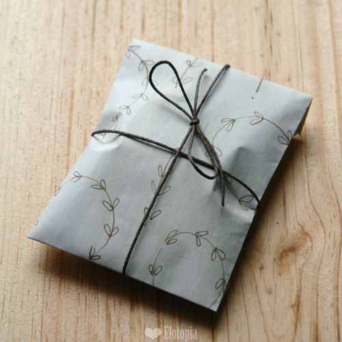 a wrapped present sitting on top of a wooden table