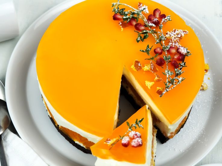 there is a cake that has been cut in half on a plate with the words mandarin gingerbread cake above it