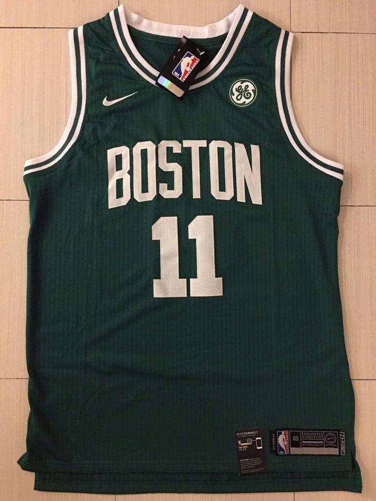 the boston basketball jersey is hanging on the wall