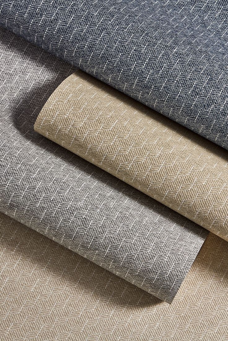 four different colors of fabric, one in grey and the other in beige on a white background