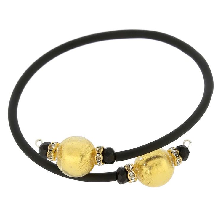 Adorn your wrist with this lovely Murano Glass bracelet - a great reflection of Venice with its trendy present and opulent past. A simple black band connects gorgeous Murano beads in rich colors lined with 24ct gold foil. This Venetian bracelet handcrafted by Murano Glass artisans using ancient glass-making techniques makes a wonderful gift for any style-conscious woman. Each round bead measures just under 1/2 inch in diameter, the connector is rubber-covered wire, which adjusts to a variety of Elegant Stretch Bracelet For Party, Elegant Black Beaded Bracelets, Elegant Black Bead Stretch Bracelet For Parties, Elegant Black Beads Stretch Bracelet, Elegant Gold Bracelets With Black Beads, Elegant Adjustable Black Beads Stretch Bracelet, Elegant Black Beaded Stretch Bracelet For Party, Adjustable Black Beads Bracelet For Formal Occasions, Adjustable Bracelets With Black Beads For Formal Occasions