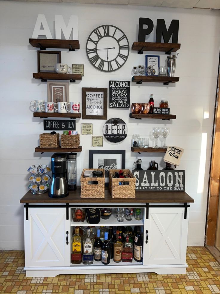 a room with shelves and various items on the wall next to a clock above it