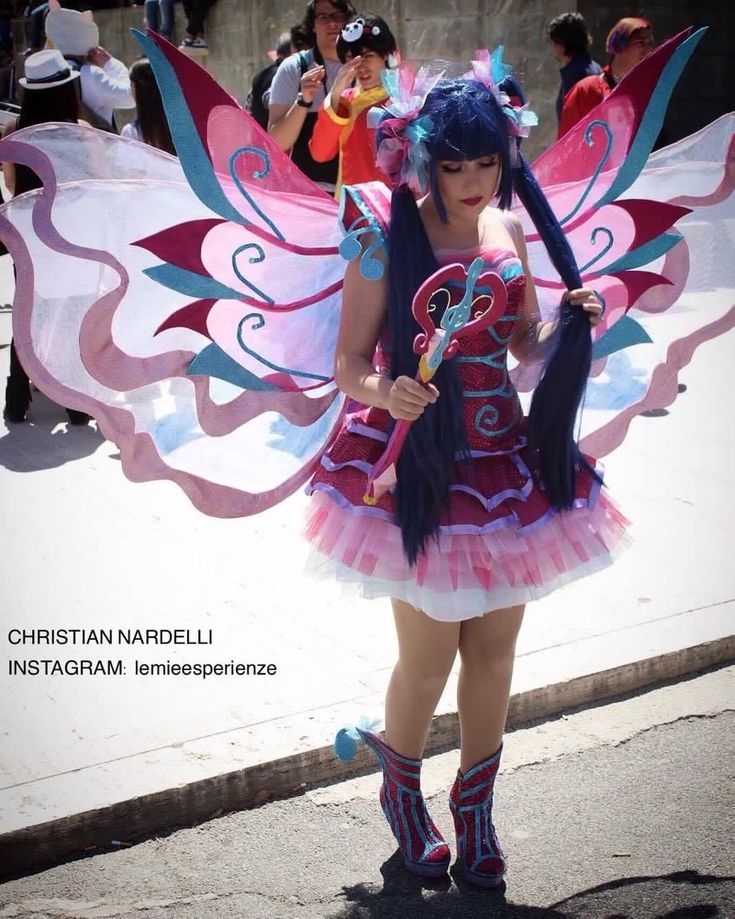 a woman dressed as a fairy with wings