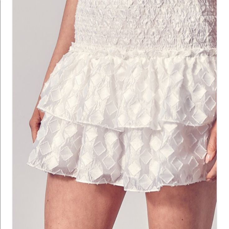 Textured. Flowy. Very Comfortable. White Flirty Skirt For Spring, White Tiered Skort For Spring, Flirty White Bottoms For Day Out, White Tiered Skort For Summer, White Tiered Skirt Skort Chic Style, White Skirted Bottoms For Brunch, White Ruffled Skort For Party, White Skort For Brunch, White Skirt For Brunch