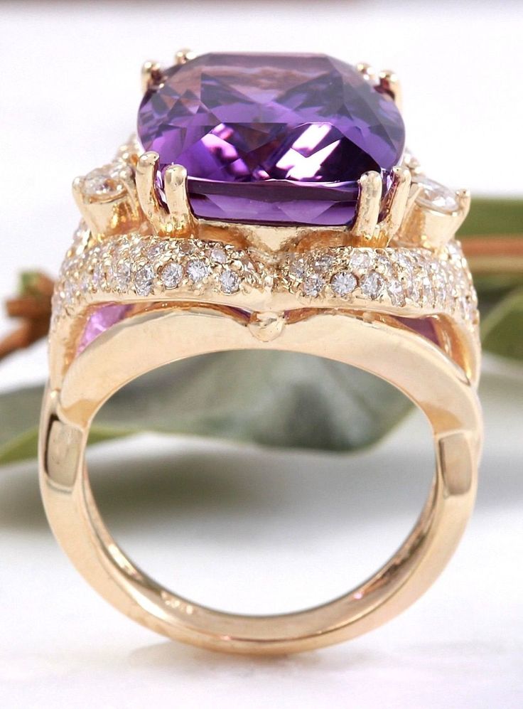 13.50 Carats Natural Amethyst and Diamond 14K Solid Yellow Gold Ring Suggested Replacement Value: $7,400.00 Total Natural Cushion Shaped Amethyst Weights: Approx. 12.00 Carats Amethyst Measures: 17.00 x 13mm Natural Round Diamonds Weight: Approx. 1.50 Carats (color G-H / Clarity SI1-SI2) Ring size: 7 (free re-sizing available) Ring total weight: Approx. 12.00 grams Disclaimer: all weights, measurements and colors are approximate and may vary slightly from the listed dimensions or as seen in the Emerald Cut Aquamarine Ring, Natural Cushions, Emerald Cut Rings, Etsy Gold Ring, Amethyst Gem, Purple Band, Aquamarine Rings, Yellow Gold Ring, Ring Size 7