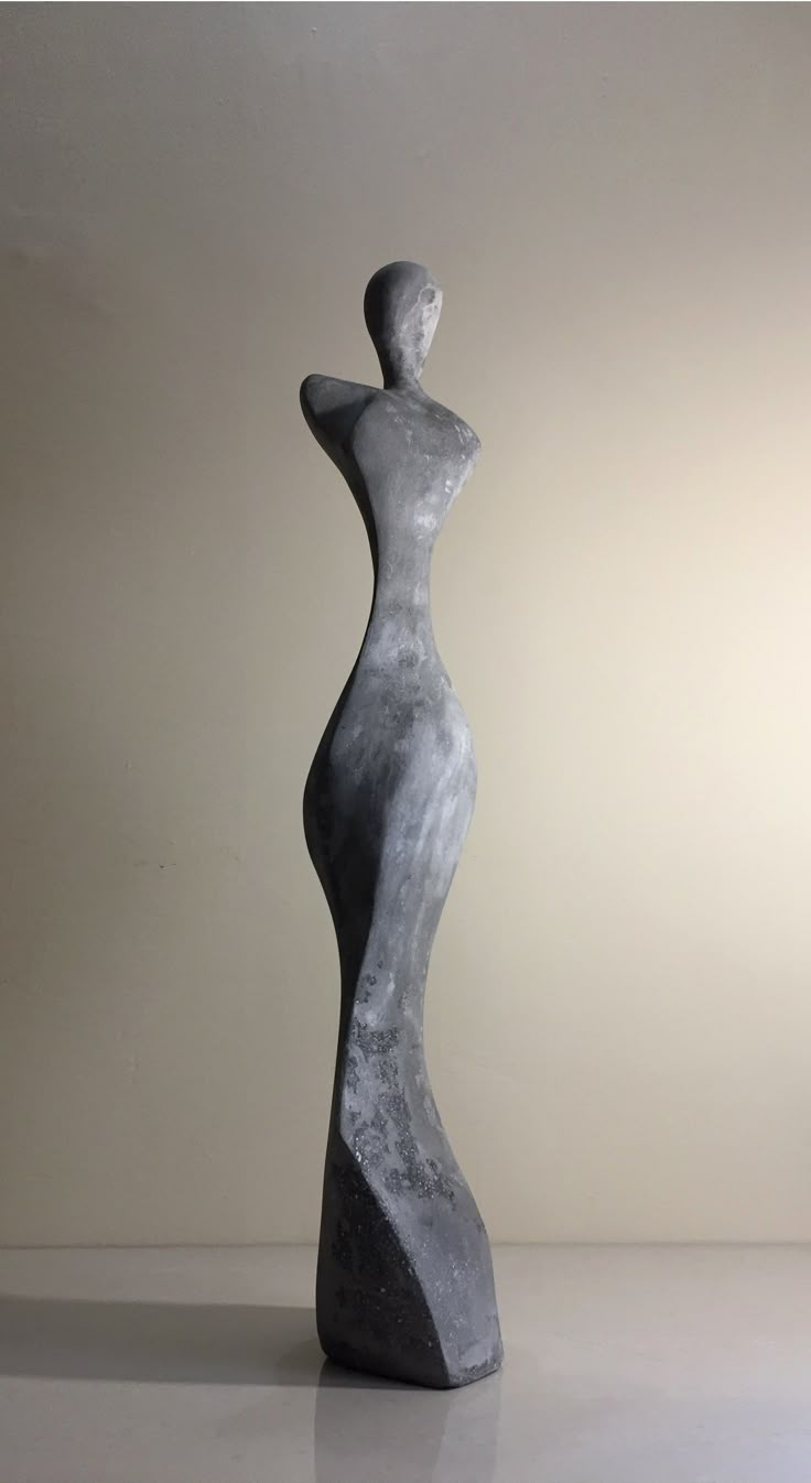 an abstract sculpture is shown against a white background with the image of a woman's torso