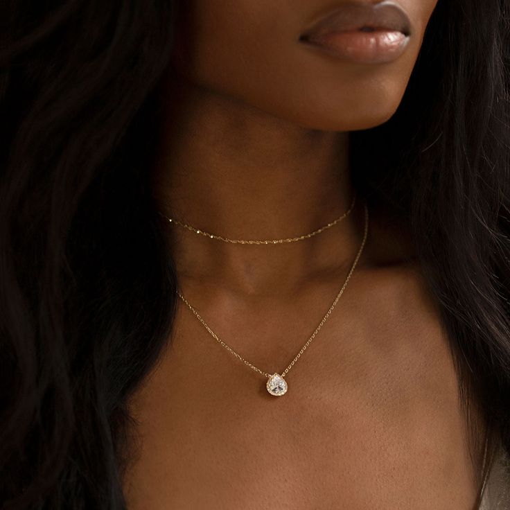 Classic and elegant front necklace that matches your back pendant necklace. This double layered necklace set features two separate adjustable chains that is worn together with your back necklace. Trust us, this is the prettiest way to wear it! Gold Vermeil Cubic Zirconia pave crystals Hypoallergenic, lead and nickel free Pendant Height: 12mm x Width: 9mm Chain lengths are adjustable and custom to your neck measurements #N530 NBCH1-2 Business Days Elegant Adjustable Layered Chain Necklace, Minimalist Adjustable Double Chain Necklaces, Delicate Double Chain Necklaces, Delicate Adjustable Layered Necklace With Clavicle Chain, Delicate Adjustable Clavicle Chain Layered Necklace, Double Strand Clavicle Chain Choker For Layering, Double Strand Delicate Chain Choker For Layering, Delicate Double Strand Everyday Layered Necklace, Delicate Double Strand Everyday Necklace