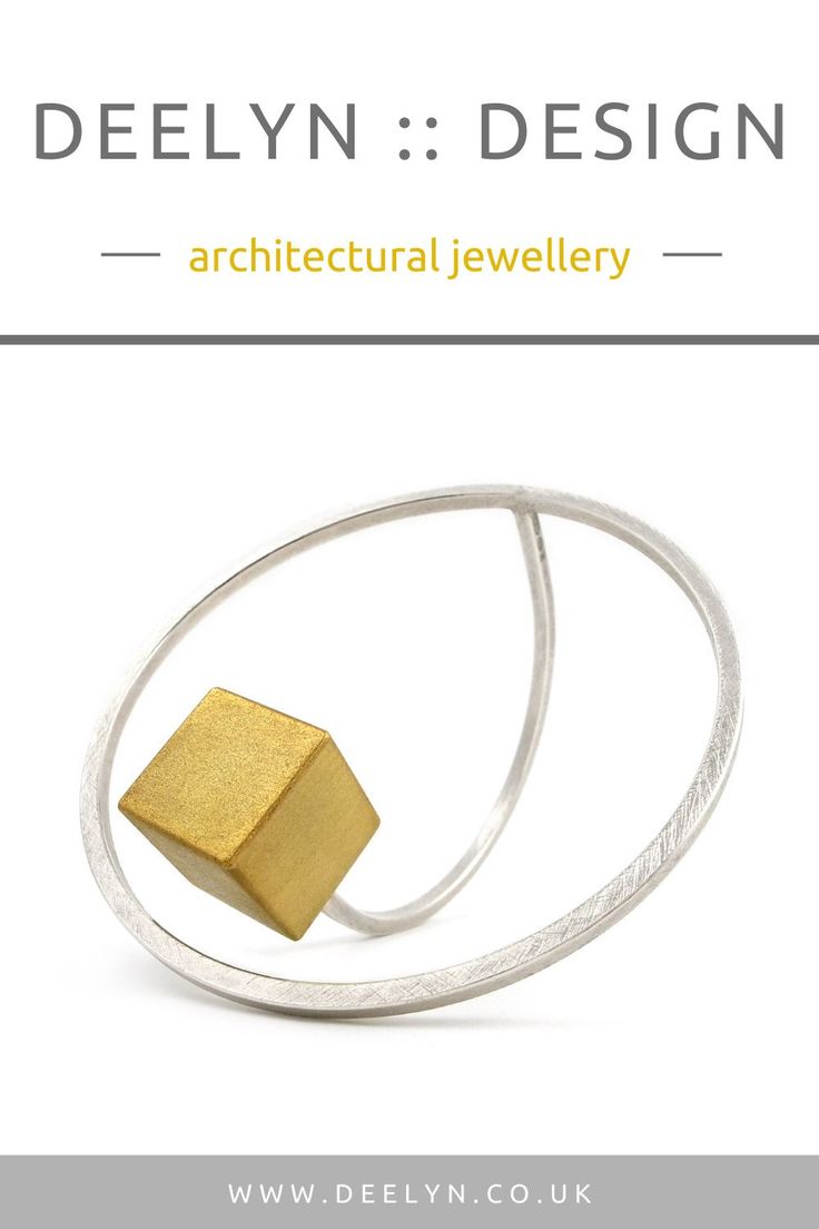 the cover of delyn design's architectural jewelry catalogue, featuring an image of a cube