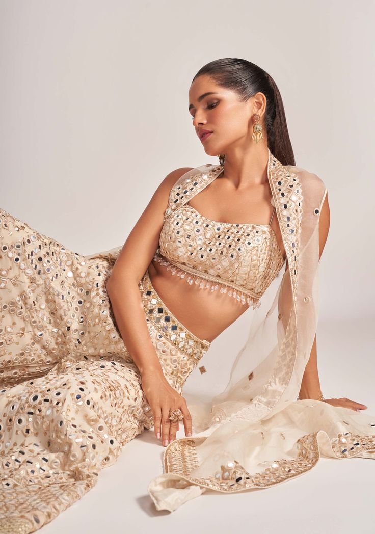 The gold avantika co-ord set is a stunning combination featuring a tussar blouse with a delicate cape in organza and viscous pants. This ensemble offers a blend of opulence and contemporary style, making it an ideal choice for sophisticated and fashionable events. Cape Set, Indian Arts And Crafts, Personal Shopping Service, Co Ord Set, Personal Shopping, Co Ord, Personal Stylist, Contemporary Style, Cape