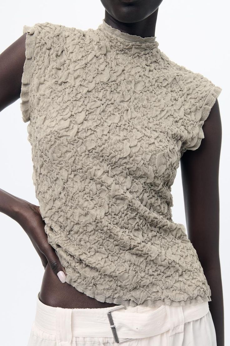 WRINKLED EFFECT KNIT TOP - Stone | ZARA United States Fitted Textured Knit Top For Party, Sleeveless Ruched Beige Tops, Beige Sleeveless Ruched Top, Beige Ruched Sleeveless Top, Chic Textured Summer Tops, Beige Ruched Stretch Top, Chic High Neck Top With Ruffles, Fitted Sleeveless Knit Top With Ruffles, Chic Textured Fitted Blouse