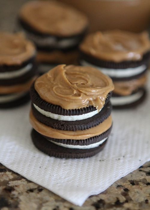 some cookies with peanut butter frosting on them