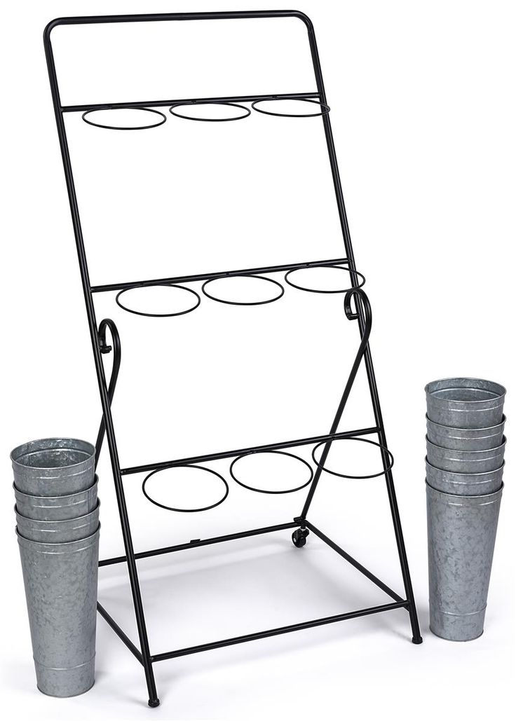 a metal rack with two buckets next to it on a white background and one is empty