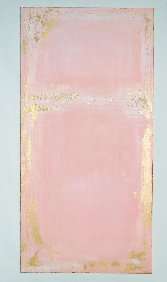 a pink and gold painting on a white wall