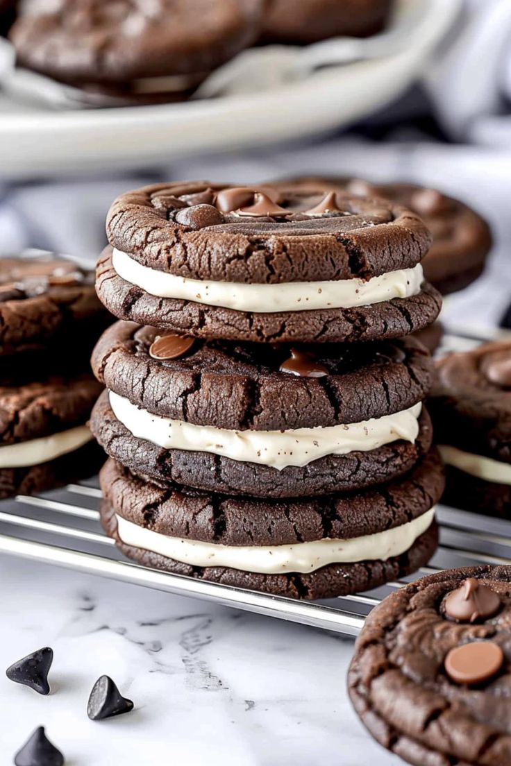 chocolate cookies with cream filling and oreo cookies stacked on top of eachother