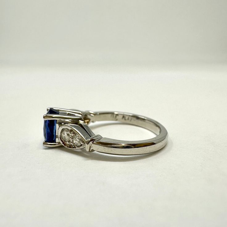 Platinum Ring with Sapphire and Diamond (includes appraisal, Value: $8,000) Designer = Jewelry Size = 5 Material = Platinum Gemstone = Sapphire/Diamond Condition = Very Good Class = Premier Location: Wilmette Item Number: 14175-270 Item ID: 285856 Category: Ring Timeless Emerald-cut Sapphire Promise Ring, Timeless Emerald Cut Sapphire Promise Ring, Luxury Platinum Topaz Ring With Accent Stones, Timeless Sapphire Ring For Promise, Classic Platinum Gemstones Gia Certified, Gia Certified Platinum Classic Gemstones, Classic Gia Certified Platinum Gemstones, Timeless Sapphire Diamond Ring With Emerald Cut, Timeless Oval Sapphire Ring Vvs Clarity