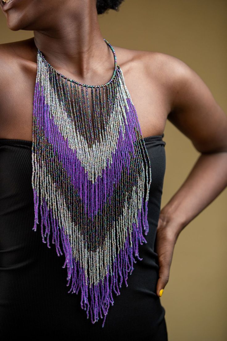 Unique African Maasai Handcrafted Beaded Necklace with an Elegant Look and Brilliant Finish. Color = Purple and Pink . Length (Around Neck) = 17 Inches/ 44 Centimeters. Length ( Downwards ) = 15 Inches / 39 Centimeters. **GET FREE SHIPPING FOR ADDITIONAL ITEMS PURCHASED. Yes, Buy Multiple Items and pay shipping for 1 item only- The rest ships Free. (No Limits on the number of Multiple items). With a faster delivery time of 3 days via DHLExpress, Worldwide. Ordinary/Standard Shipping also availab Traditional Handmade Purple Beaded Necklaces, Artisan Beaded Fringe Necklaces For Festivals, Artisan Multicolor Beaded Necklaces With Fringe, Artisan Necklace With Beaded Fringe For Festivals, Artisan Multicolor Beaded Necklace With Fringe, Purple Jewelry With Beaded Fringe And Round Beads, Bohemian Purple Polished Beads, Purple Large Beads Jewelry For Festival, Bohemian Purple Beaded Necklaces With Large Beads