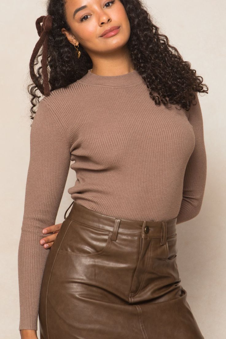 Get cozy in our stunning Lexie Top, perfect for the chilly fall days ahead. Crafted from a soft taupe ribbed knit fabric, this top features a mock neckline and long fitted sleeves for a stylish yet comfortable fit. The pull-over style and stretchy fabric make it maternity friendly. Pair with a stylish skirt to complete the look. Chic Ribbed Mock Neck Top, Fall Mock Neck Long Sleeve Top In Fine Knit, Chic Ribbed Long Sleeve Mock Neck Top, Chic Long Sleeve Ribbed Mock Neck Top, Fall Mock Neck Long Sleeve Fine Knit Top, Fall Fine Knit Long Sleeve Mock Neck Top, Beige Ribbed High Neck Sweater, Beige Ribbed High-neck Sweater, Chic Ribbed Fitted Mock Neck Top