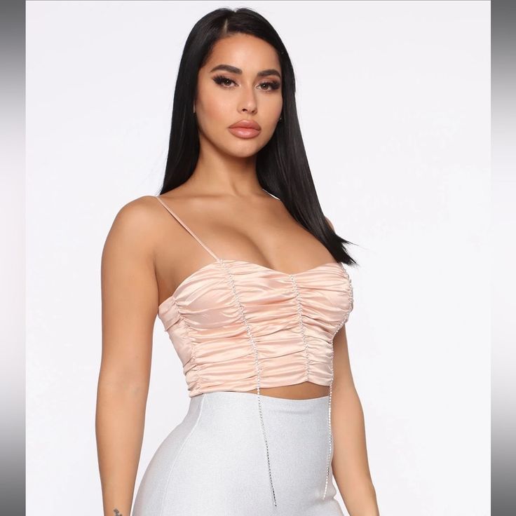 Womens Diamond Detail Satin Crop Top No Stretch New With Tags Holiday/Party Fashion Top Blush Color Cropped Silhouette Rhinestone Detailing Side Invisible Zipper 97% Polyester 3% Spandex Lining 100% Polyester Skirt Is Sold Separate Feel Free To Bundle Items And Save More!! All Reasonable Offers Are Accepted! Feminine Pink Crop Top For Night Out, Elegant Peach Tops For Party, Fitted Peach Top For Party, Peach Sleeveless Top For Party, Elegant Pink Crop Top For Night Out, Preforming Outfit, Rhinestone Crop Top, Stephanie Rao, Holiday Party Fashion