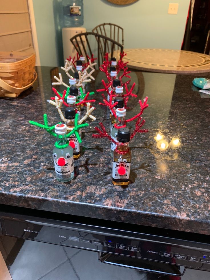 christmas decorations made out of beer bottles on top of a counter