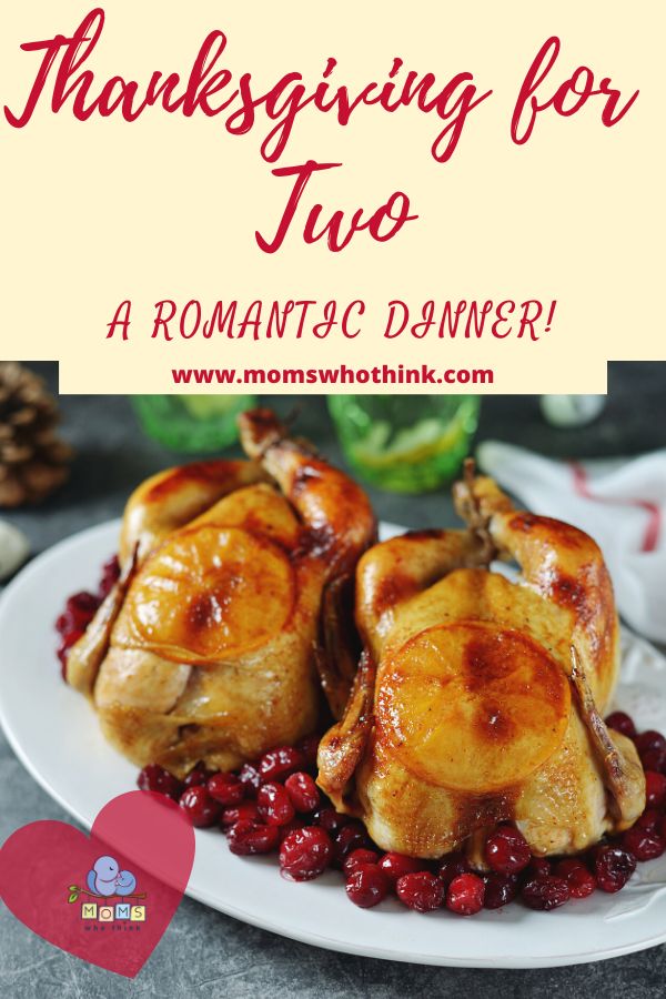 two roasted turkeys with cranberries on a white plate