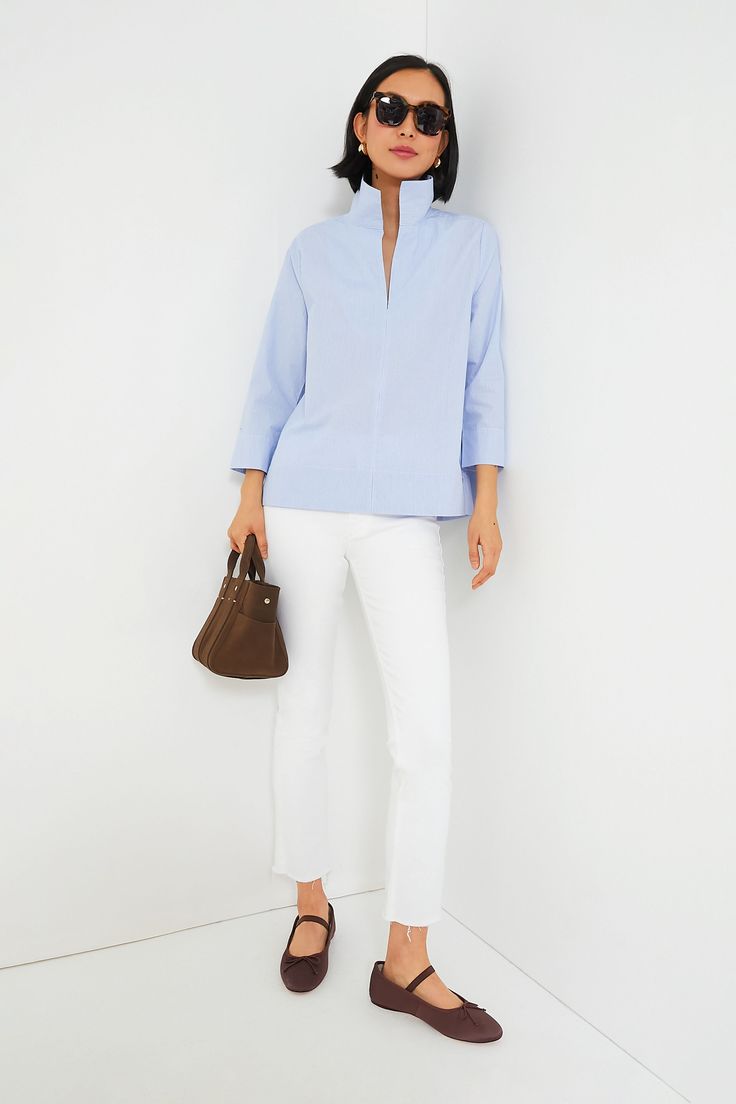 Your staple style gets a fresh update with the Sullivan Blouse. Made from a lightweight and crisp cotton material that provides effortless polish with a classic blue pinstripe print that pairs well with all kinds of neutrals, this stand collared shirt is a must-have in any closet. Style it with denim and sneakers for off-duty weekend wear, under a cardigan with boots when the temps drop, or with a sweet skirt and ballet flats for feminine flair. Stand collar V-neckline Bracelet length sleeves wi Stand Collar Blouse, Stand Collar Shirt, Blouse Sale, Plus And Minus, Cocktail Attire, Weekend Wear, Collared Shirt, Collar Blouse, Classic Blue