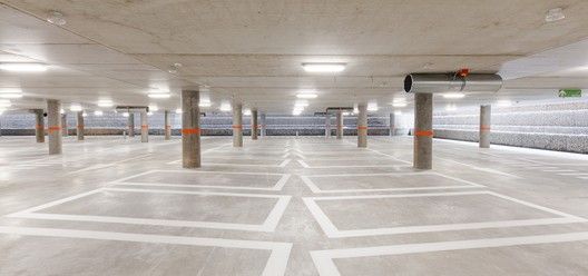 an empty parking garage filled with lots of lights