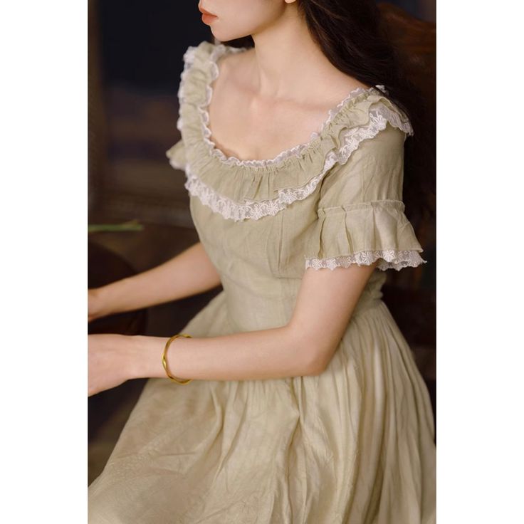 For a noble and elegant young lady, like a sparkling jewel in a palace. A retro dress that reminds you of the season of fresh greenery. The neckline and cuffs are decorated with lace embroidery and ruffles. The way she sways gently and gracefully is captivating. 
 
 Size 
 
 S size 
 
 Length: 121cm 
 Shoulder width: 35cm 
 Bust: 84cm 
 Waist: 70cm 
 
 Sleeve length: 18cm 
 
 M size 
 
 Length: 122cm 
 Shoulder width: 36cm 
 Bust: 88cm 
 Waist: 74cm 
 
 Sleeve length: 18cm 
 
 L size 
 
 Length: A-line Lace Dresses With Ruffles, Spring Vintage Dress With Square Neck And Ruffles, Fitted A-line Lace Dress With Ruffles, Lace A-line Dresses With Ruffles, Fitted A-line Vintage Dress With Ruffles, Elegant Cotton A-line Vintage Dress, Fitted Green Dress With Ruffle Hem, Knee-length Dress With Lace Trim And Fitted Bodice, Feminine A-line Vintage Dress With Ruffles