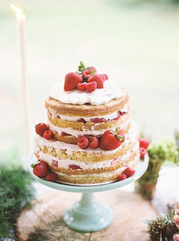 a layered cake with strawberries on top