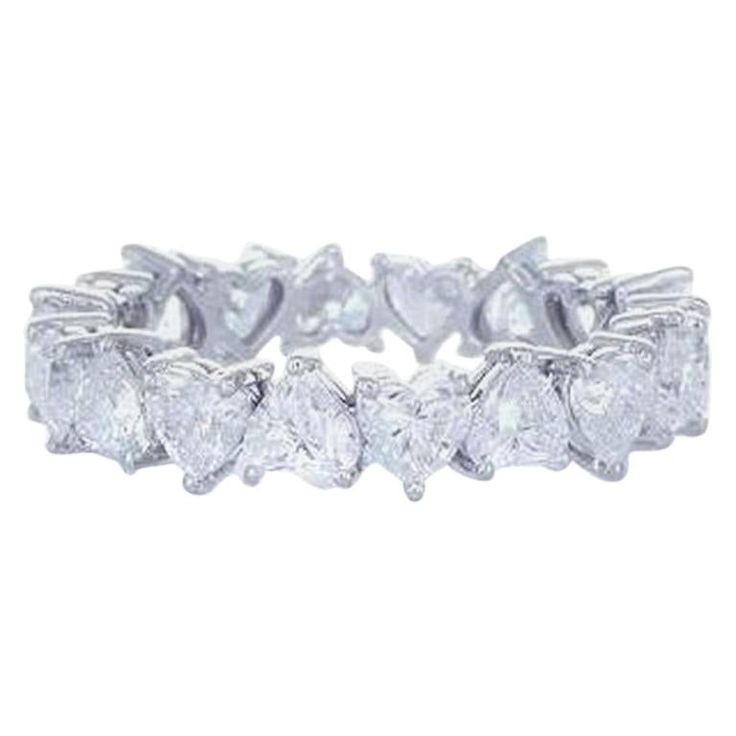 Our Dazzling Eternity Ring is handcrafted from 18 heart shaped cut diamonds that are ideal cut and were manufactured to match each other. Matching diamond hearts require perfection and knowledge which translates to an eye catching lushness. The high quality diamonds are mounted on 18K white gold. Jewel Details: 18 Heart Shape cut diamonds E-F/ VS Total Diamond Weight 3.64 Carat Rind wide is 4.7mm Ring size 6.5 and can be resized 18K White Gold Heart Eternity Ring, Ring Leader, Diamond Heart Ring, Gold Cocktail Ring, Diamond Jewelry Designs, Expensive Jewelry, Heart Shaped Diamond, Eternity Wedding Band, Eternity Ring Diamond