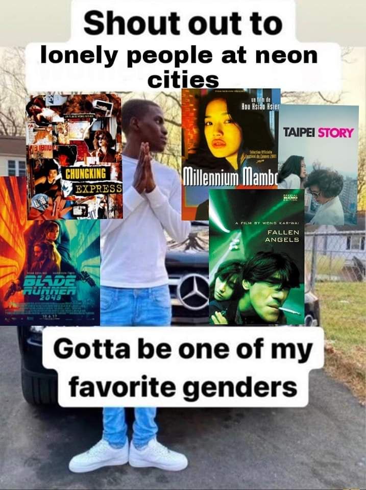 a man standing in front of a truck with posters on it's side and the caption that reads, i should be one of my favorite genderers