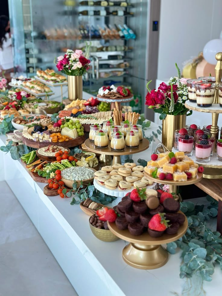 an assortment of desserts and pastries on display