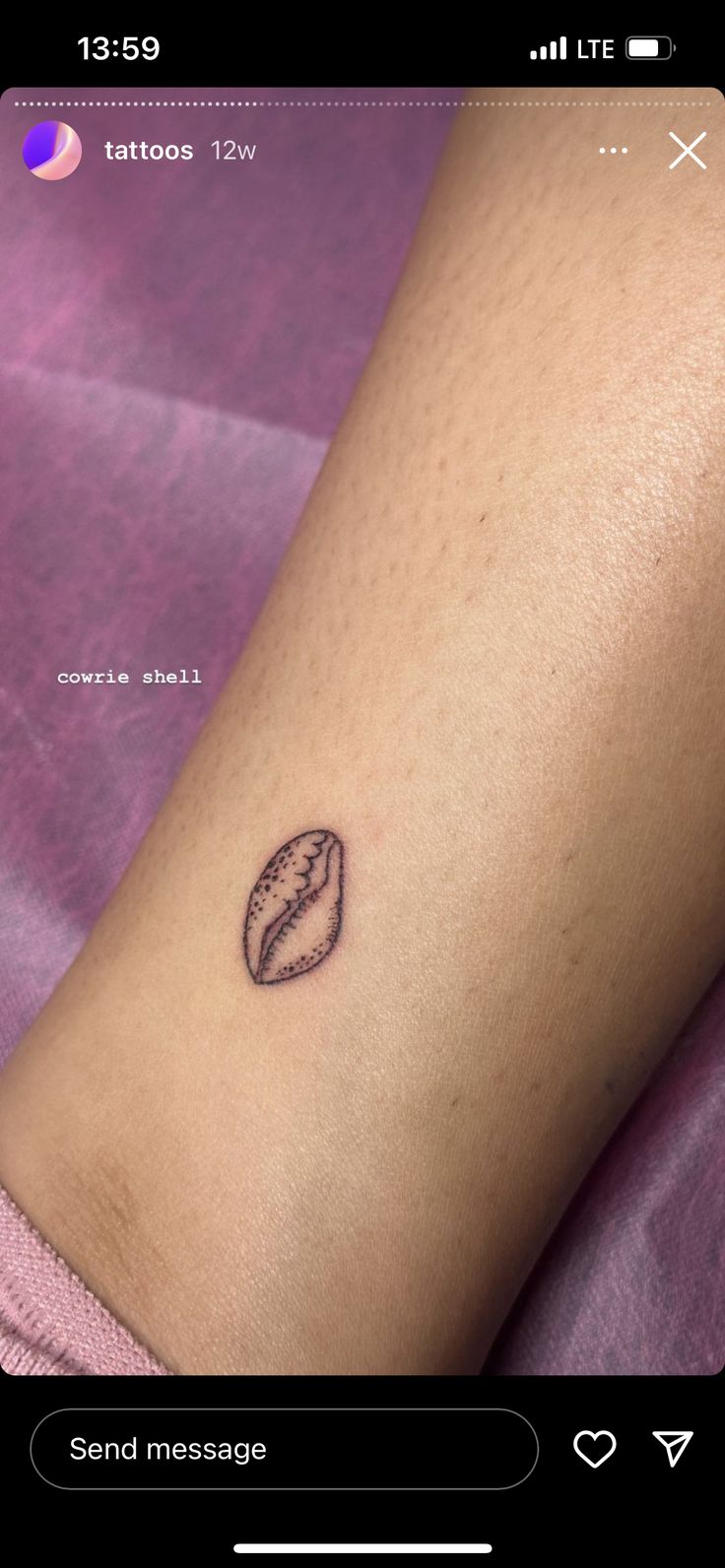 a small tattoo on the arm of a woman's left leg, with a leaf in it