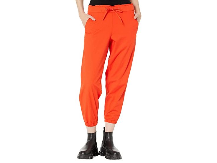 Levi's(r) Womens Off Duty Joggers - Women's Clothing : Comfy Orange Enamel : Boost your chill style wearing the super-comfy and stylish Levi's Womens Off Duty Joggers. Mid-rise, elasticized waist with drawstring closure. Elasticized cuffs. Tapered leg. Front slant pockets and back patch pockets. 59% cotton, 38% viscose, 3% elastane. Machine wash, tumble dry. Imported. Measurements: Waist Measurement: 28 in Outseam: 35 in Inseam: 25 in Front Rise: 10 in Back Rise: 13 in Leg Opening: 10 in Product Casual Spring Joggers With Pull-on Style, Utility Style Sweatpants With Drawstring, Utility Sweatpants With Drawstring And Relaxed Fit, Utility Style Sweatpants With Drawstring And Relaxed Fit, Utility Style Relaxed Fit Sweatpants With Drawstring, Relaxed Fit Parachute Pants With Hip Pockets, Relaxed Fit Athleisure Parachute Pants With Hip Pockets, Athleisure Parachute Pants With Hip Pockets And Relaxed Fit, Athleisure Parachute Pants With Hip Pockets