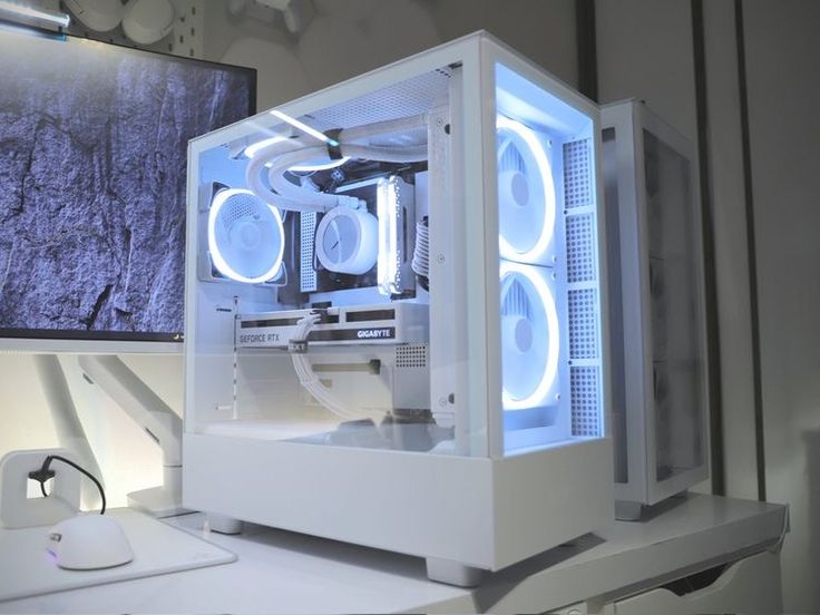 a white computer case sitting on top of a desk