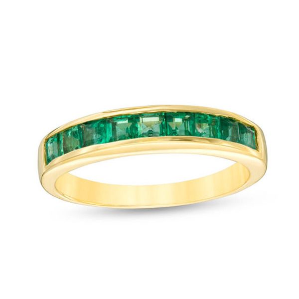 This eye-catching gemstone band is an understated yet vibrant choice she’ll love. Shimmering in warm 14K gold, this slender band is lined along the front edge with a row of dazzling channel-set princess-cut verdant-green emeralds. Polished to a bright shine, this colorful accent piece lends an element of interest to her look. Elegant Yellow Gold Emerald Ring With Channel Set, Formal Half Eternity Emerald Ring, Fine Jewelry Emerald Eternity Band In Yellow Gold, Emerald Cut Gemstone Eternity Band For Formal Occasions, Yellow Gold Emerald Ring With Half Eternity Style, Formal Emerald Cut Gemstone Eternity Band, Yellow Gold Half Eternity Emerald Ring, Classic Yellow Gold Eternity Band With Gemstone, Formal Emerald Cut Eternity Band With Gemstone