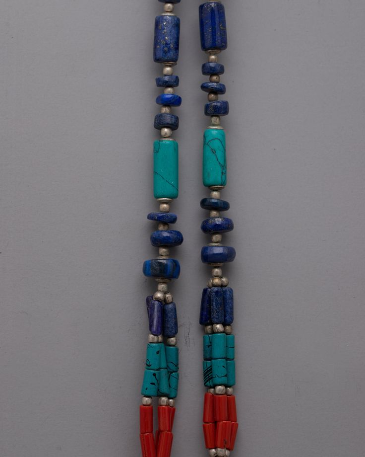 Nepal Tibetan Jewelry Necklace About Our Locket Introducing the exquisitely crafted Nepal Tibetan Jewelry Necklace, which blends traditional workmanship with vivid colors and materials. This gorgeous necklace is 28 cm long and weighs 0.056 kg. It is made of white metal and is embellished with artificial stones such as lapis lazuli, turquoise, and coral. The building pattern and stone choices pay homage to the rich artistic and cultural traditions of Tibetan and Nepalese jewelry. The Nepal Tibeta Traditional Multicolor Turquoise Necklace As A Gift, Traditional Necklaces With Natural Stones For Meditation, Traditional Turquoise Pendant Necklace With Gemstone Beads, Multicolor Adjustable Traditional Turquoise Necklace, Traditional Turquoise Necklace With Polished Beads For Gift, Traditional Turquoise Pendant Necklace With Polished Beads, Traditional Turquoise Necklace With Polished Beads As A Gift, Traditional Multicolor Turquoise Necklace With Gemstone Beads, Traditional Gemstone Necklaces For Rituals