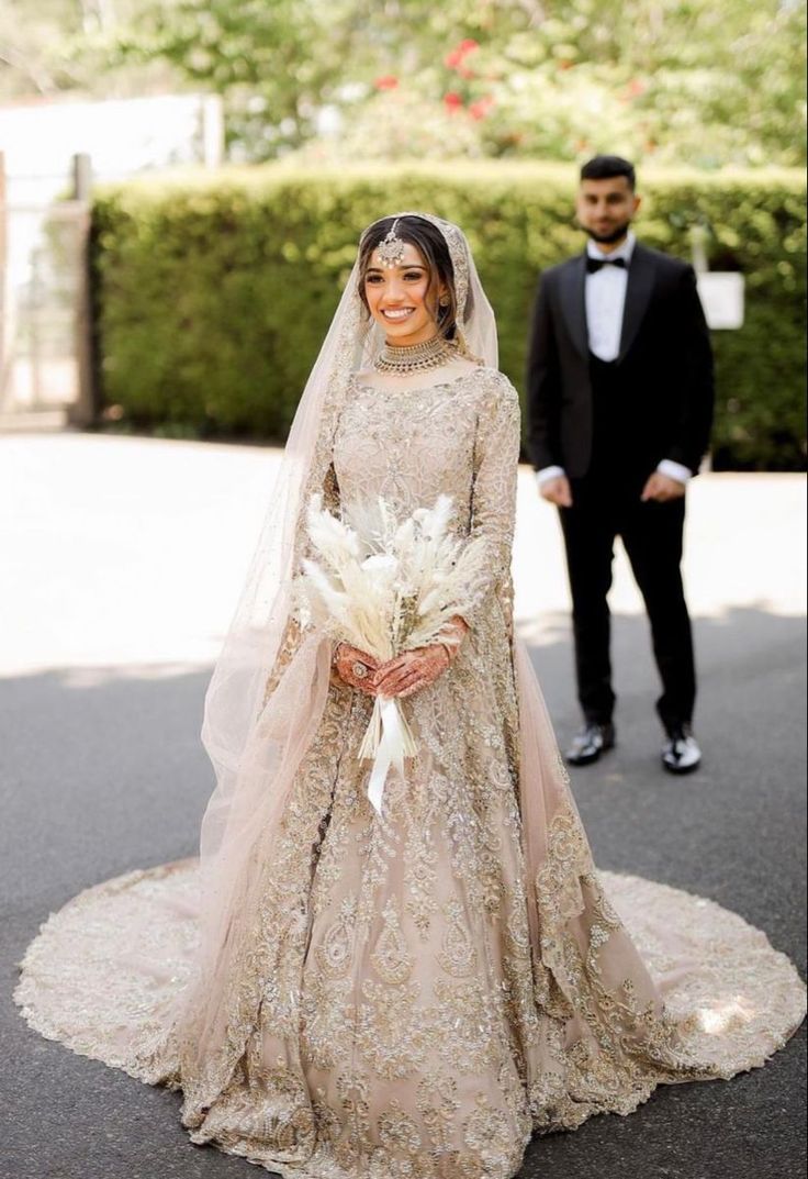 the bride and groom are walking down the street