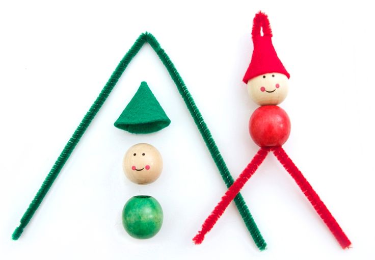 an assortment of toys made to look like christmas trees and elfs with faces on them