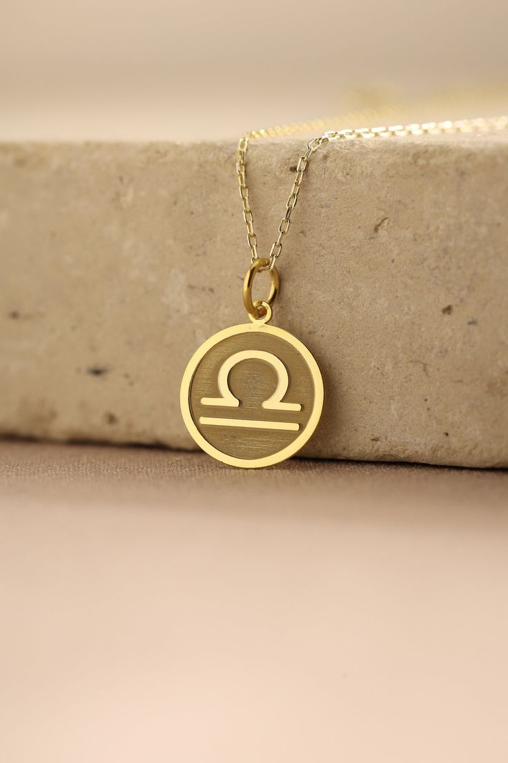 Gold Libra Pendant - Libra Gold Necklace ● Material of pendant: Solid Gold 14k ( REAL GOLD ) ● Metal Stamp: 14k ( REAL GOLD ) ● The pendant is available in 5 sizes: - 12,7 mm / 0.5 inches (Diameter) - 14,0 mm / 0,55 inches ( Diameter ) In the photos - 15,3 mm / 0.6 inches ( Diameter ) - 16,5 mm / 0,65 inches ( Diameter ) - 19,1 mm / 0,75 inches ( Diameter ) ( In the photos the size is 14mm / 0.55 inches Diameter ) ( Jump Ring inner diameter: 4 mm ) ● Material of chain: Solid gold 14k ( REAL GOLD Yellow Gold Zodiac Sign Pendant Jewelry, Gold Zodiac Sign Jewelry, Yellow Gold Zodiac Sign Jewelry, Gold Zodiac Sign Jewelry For Anniversary, 14k Gold Zodiac Sign Jewelry, Libra Fashion, Libra Jewelry, Libra Pendant, Gold Pendants For Men