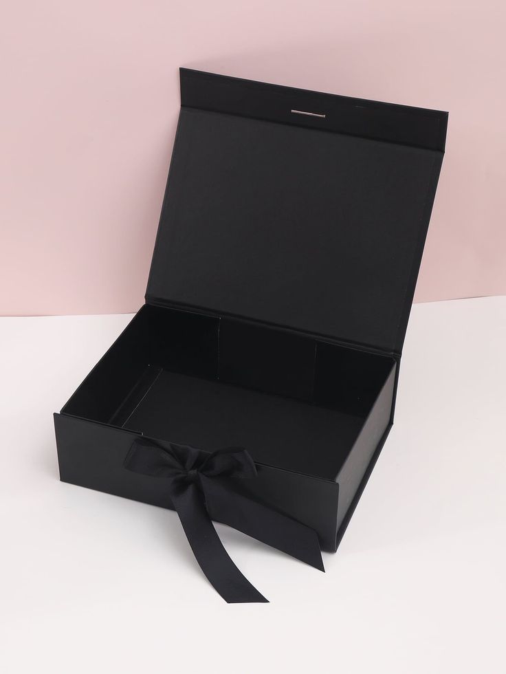 an open black box with a bow on it