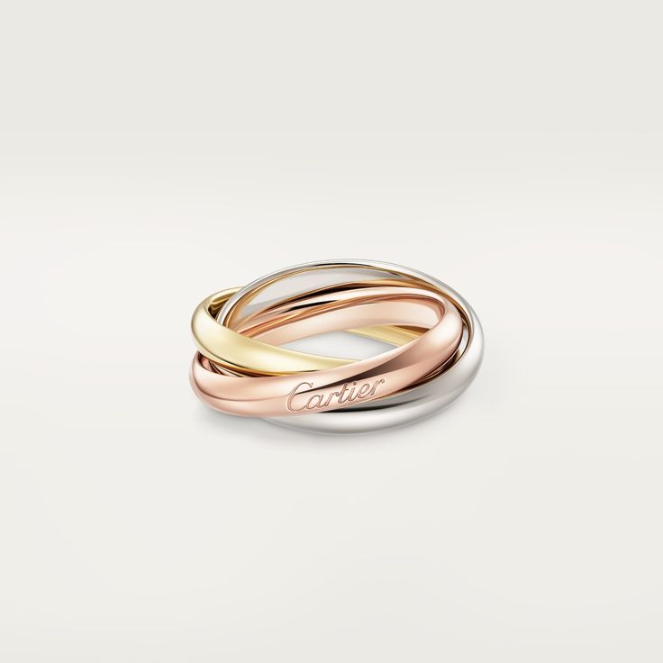 Classic Trinity ring Cartier Rose Gold Wedding Ring, Luxury Cartier Rose Gold Ring, Elegant Cartier Rose Gold Rings, Modern Cartier Rings With Polished Finish, Cartier 14k Gold Rings For Anniversary, Timeless Cartier White Gold Ring, Modern Cartier Rings For Anniversary, Timeless White Gold Cartier Ring, Classic White Cartier Rings