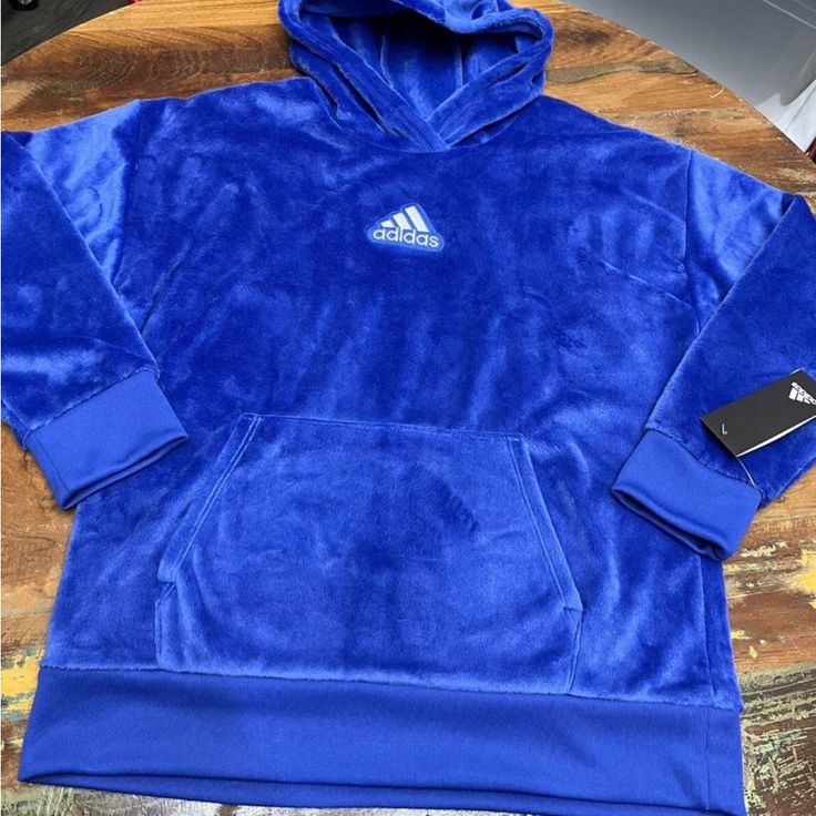 Soft, Warm And Fuzzy Adidas Hoodie. Front Pouch Pocket. Bright Blue. Adidas Size 14 Large Blue Hooded Sweatshirt For Winter, Blue Hooded Winter Sweatshirt, Blue Sports Hoodie With Fleece Lining, Blue Fleece Hoodie For Winter, Blue Hoodie With Drawstring For Cold Weather, Cozy Blue Fleece Sweatshirt, Adidas Sweatshirt With Adjustable Hood For Winter, Adidas Winter Sweatshirt With Adjustable Hood, Blue Hoodie With Fleece Lining For Winter