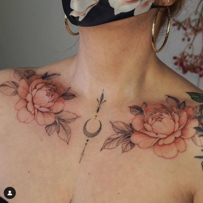 a woman with flowers on her chest wearing a face mask to protect it from the sun