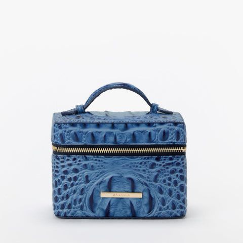 a blue box with an alligator skin pattern on the front and gold trimmings