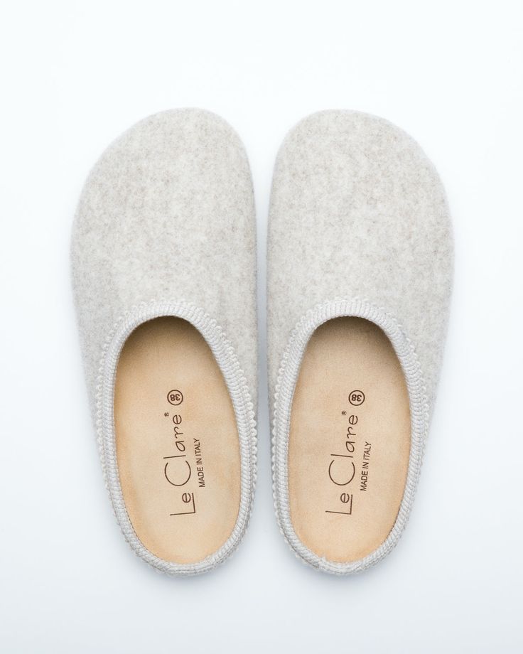 Description: The Nebraska Women's Wool Clog is an Italian take on a European classic. The women's Nebraska in beige is one of the most versatile mule style slippers available. From home to the office to weekend, the minimalist design of these clogs will take you anywhere in comfort. The anatomical self-molding latex and thermoforming cork insole provide firm customized comfort, and the insole is completely removable. LeClare Slippers are exclusively handcrafted in our small-batch factory in Trev Classic Slip-on Mules With Textured Footbed, Beige Clogs With Textured Footbed And Flat Heel, Comfortable Beige Clogs With Textured Footbed, Indoor Closed Toe Clogs With Cushioned Footbed, Everyday Comfortable Flat Heel Mules, Comfortable Flat Heel Mules For Everyday Wear, Comfortable Everyday Flat Heel Mules, Classic Closed Toe Clogs With Textured Footbed, Classic Slip-on Slippers With Textured Footbed