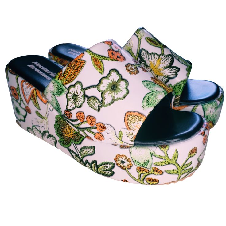 Turn heads at every summer event in the Flower Power Platform Sandals, the flatform version of our best-selling boots. Whether you're hitting a music festival or enjoying a casual day out, these sandals will make you feel unstoppable. Retro Floral Print: Captivating floral design that brings a touch of 70's nostalgia. Open-Toe Design: Perfect for showing off your summer pedicure and staying cool. Flatform Style: Provides height and stability without compromising comfort. Padded Footbed: Ensures Trendy Summer Wedge Sandals With Chunky Platform, Trendy Slip-on Platform Slippers For Summer, Summer Chunky Platform Slip-on Sandals, Summer Slip-on Sandals With Chunky Platform, Chunky Platform Slip-on Sandals For Summer, Casual Wedge Sandals With Chunky Platform For Summer, Spring/summer Open Toe Wedge Sandals, Casual Chunky Platform Wedge Sandals For Summer, Spring And Summer Style Open Toe Wedge Sandals