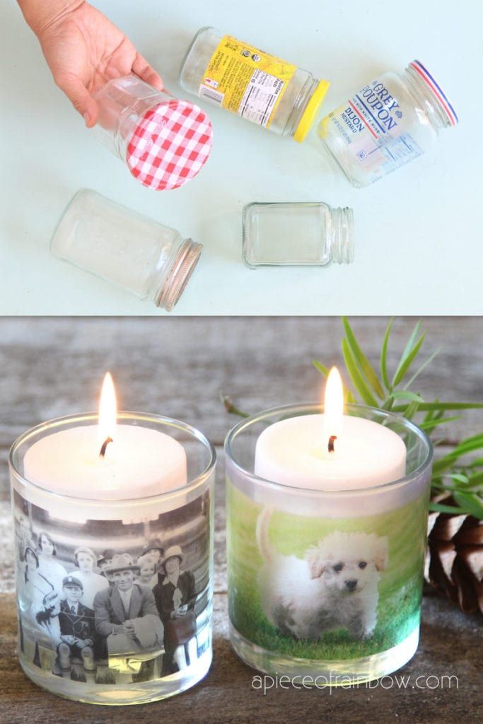 two candles that have pictures on them and some pine cones in the background with pine cones