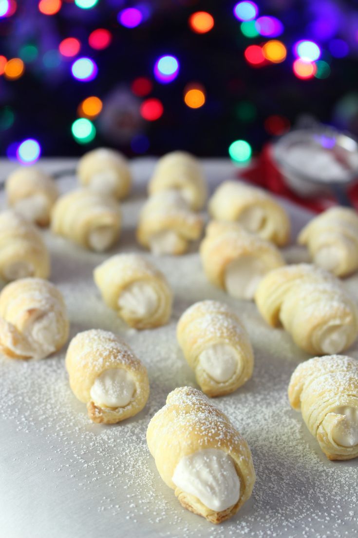 small pastries are lined up on a plate