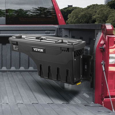 the back end of a red truck with its cargo compartment open